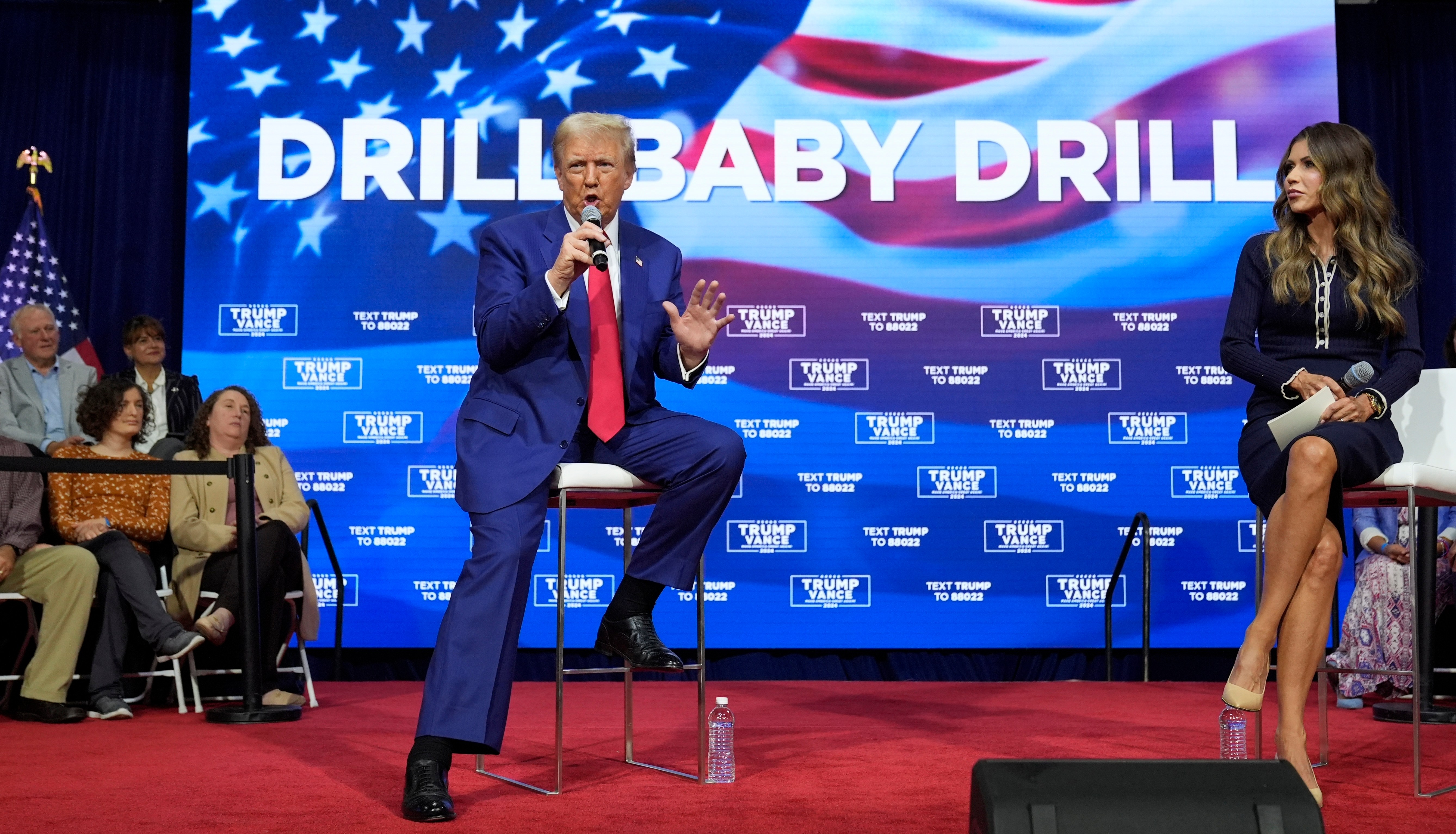 Donald Trump and Kristi Noem at a campaign town hall.
